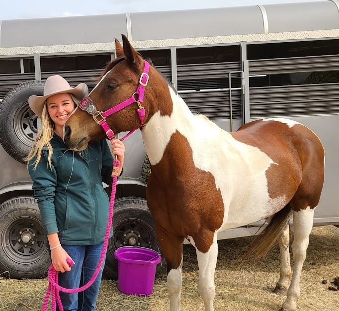 Albertas newly certified coaches in cowgirl with her pinto pony